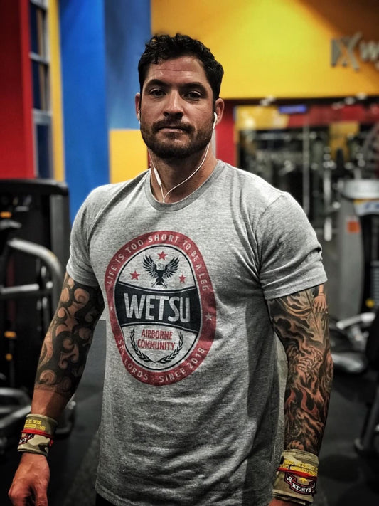 Man wearing the WETSU Crafted Gray Triblend Shirt
